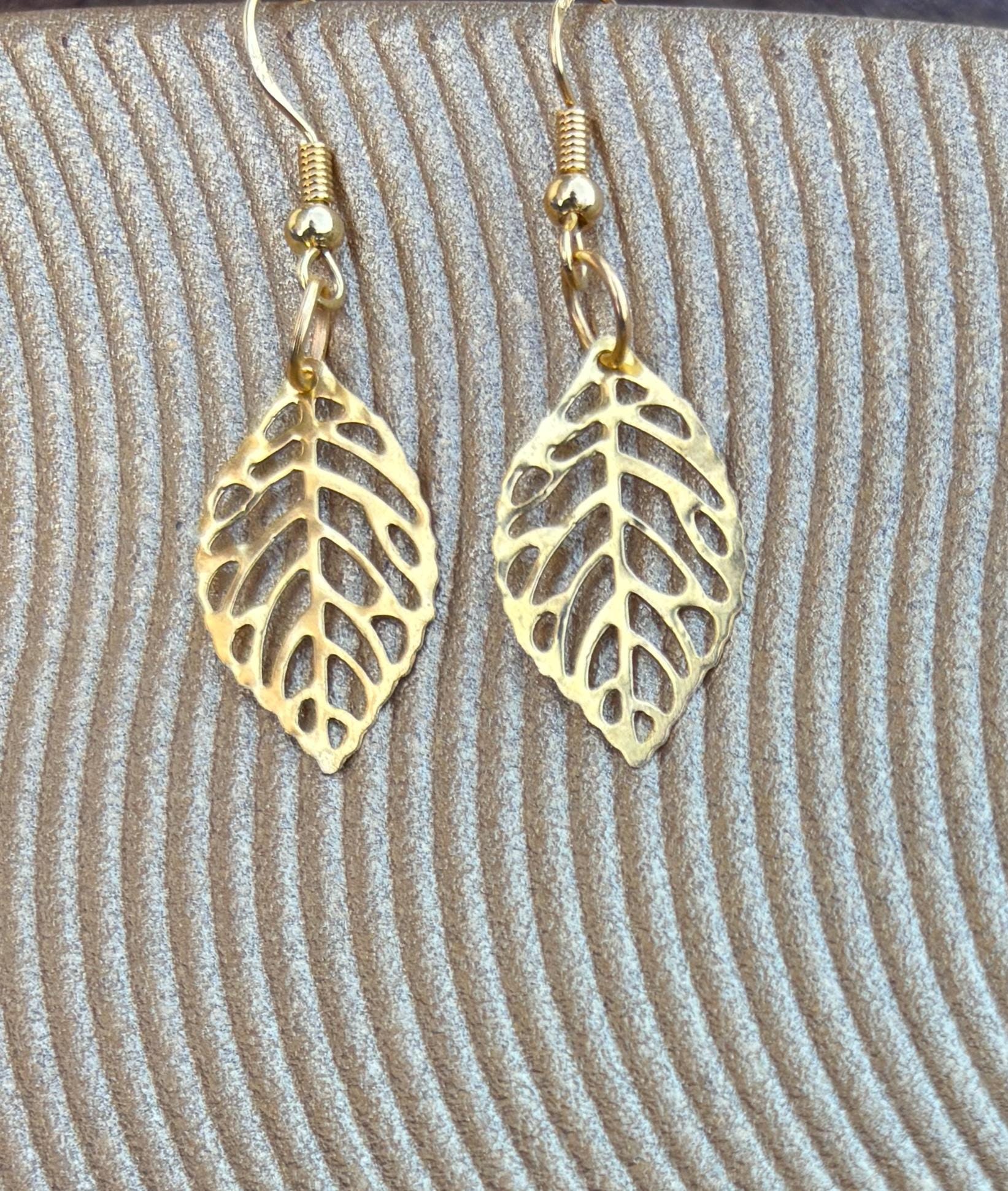 Gold Leaf Dangle Earrings | Metal Cutout Golden Leaves Boho Earrings Consecrated Jewelry Co.