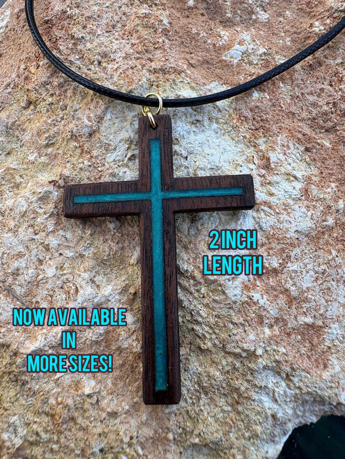 Turquoise resin-inlay walnut cross necklace on black cord, labeled 2 inches long and available in more sizes
