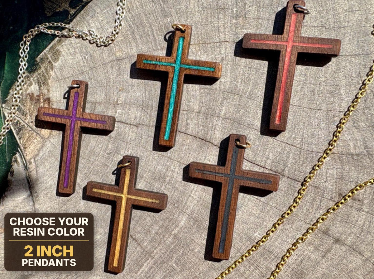 Five walnut cross pendants with purple, turquoise, red, gold, and blue resin inlays, labeled 2-inch pendants